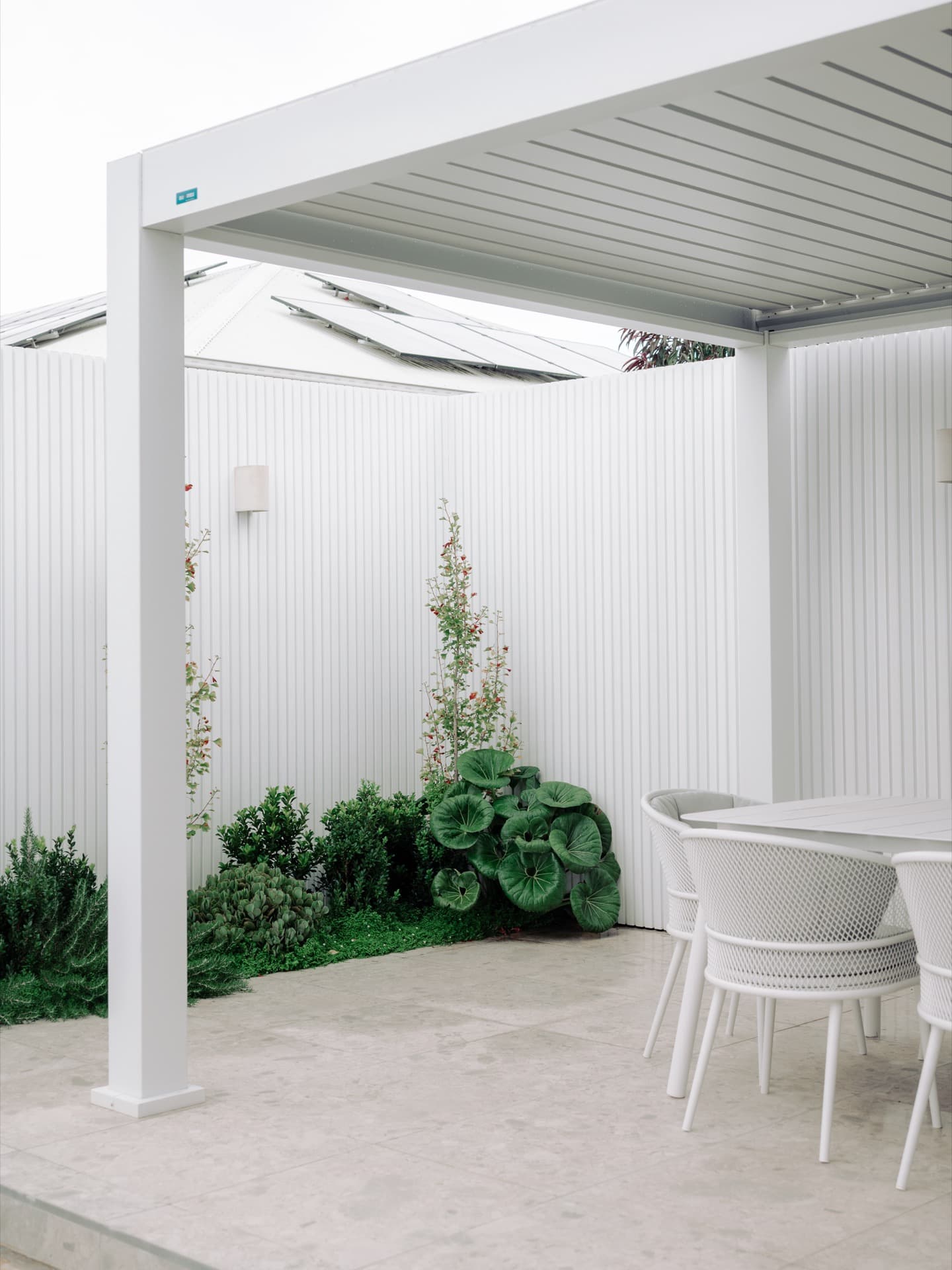 Covered outdoor dining and living area in a completed Clyde North project
